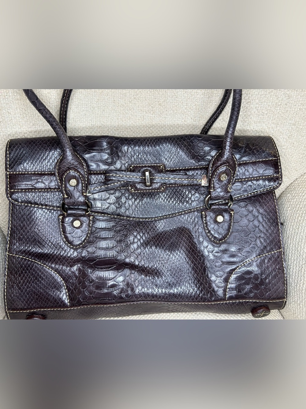 Liz Claiborne satchel featuring snake embossed pattern and double handles